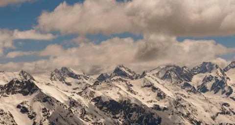 Snow-capped mountain peaks in spring. North Caucasus Stock Photos