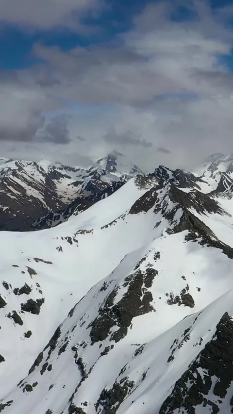 Snow-Capped Mountain Peaks in a Winter Wonderland Stock Footage 288014391