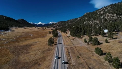 Snow Capped Mountain Range Car On Highway Aerial Shot 4K 스톡 동영상 119835568