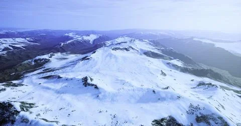 Snow capped mountain range under clear blue sky during daylight hours Stock Illustration