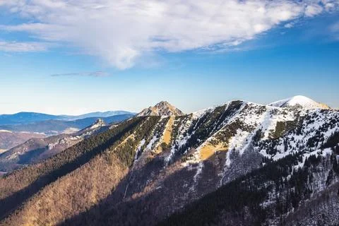 Snow-capped mountain range under a clear sky. The Mala Fatra national park .. Stock Photos