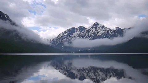 Snow-capped mountain in the reflection of the lake Stock-Footage 128001472