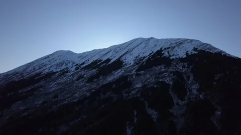 Snow capped mountain top at dusk Stock Footage 104528200