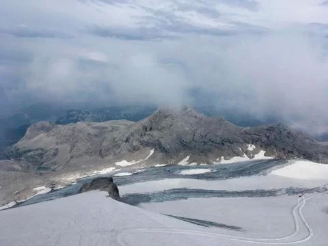 A snow capped mountain on the top Stock Photos