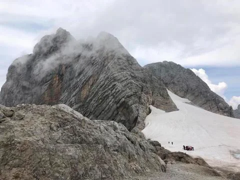 A snow capped mountain on the top Stock Photos