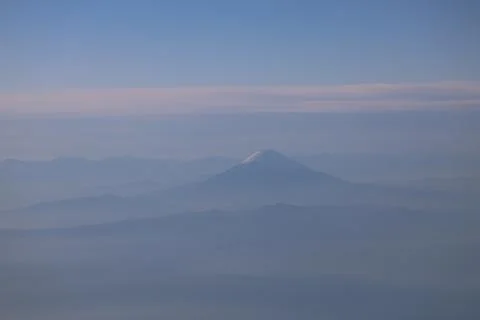 Snow Capped Mountain Under a Clear Blue Sky Stock Photos