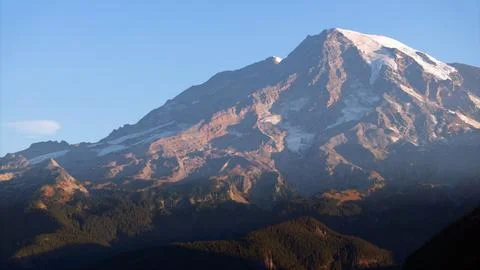 Snow-Capped Mountain in Warm Evening Light Stock Photos
