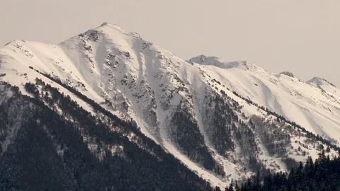 Snow-capped mountains and mountain peaks. Close-up. Front view. Video stock 106857352