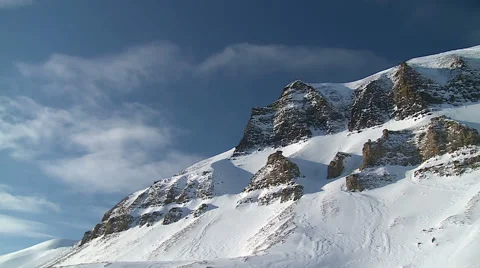 Snow-capped mountains and racing clouds. Stock Footage 49677779