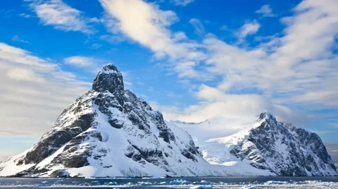 Snow-capped mountains in Antarctica. Slow motion 4K footage Stock Footage