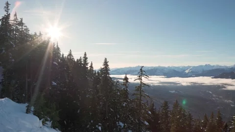 Snow capped mountains facing sun, Whistler ski resort in British Columbia Stock Footage 233110157