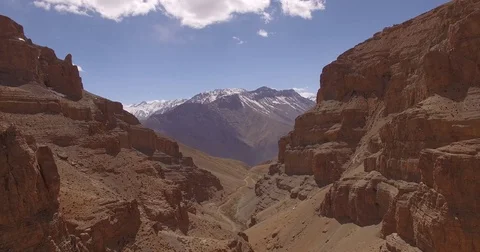 Snow-Capped Mountains Seen Through Canyon Stock Footage 81003697