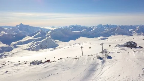 Snow-capped mountains, a ski slope with a lift. Elbrus, aerial video shooting 库存影片 114803014
