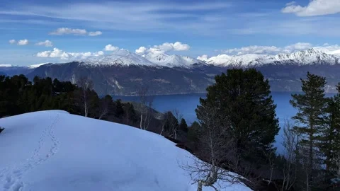 Snow-capped mountains with spring forest fjords Stock Footage 309140978