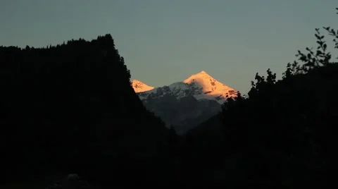 Snow-capped mountains at sunset Stock Footage 41465397