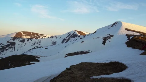 Snow-capped mountainside at sunset Video stock 116429320