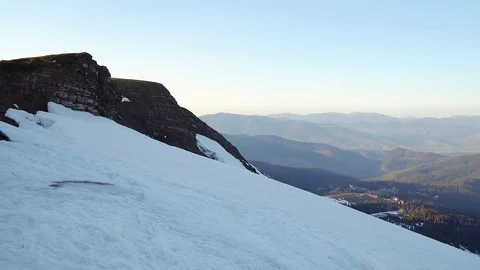 Snow-capped mountainside at sunset Stock Footage 118853220