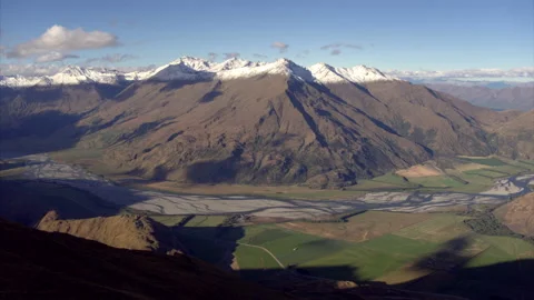 Snow capped peaks with braided river aerial Stock Footage 158514939