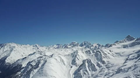 Snow-capped peaks of Mount Elbrus and Cheget in the Caucasus Mountains, a Stock Footage 309519709