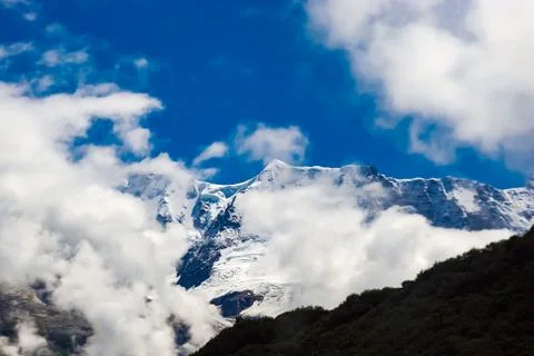 The snow-capped peaks of the mountains Stock Photos