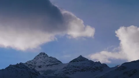 Snow Capped Peaks of the North Caucasus, Russia Under a Dramatic Sky Video stock 320853202