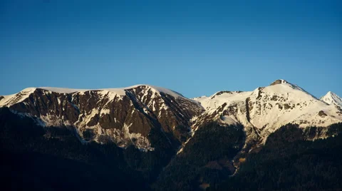 Snow-capped peaks in the setting sun Stock Footage 62471850