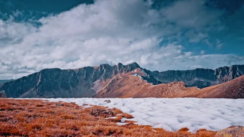 Snow-capped Pyrenees mountains under a blue sky in Spain Stock Footage 303633382