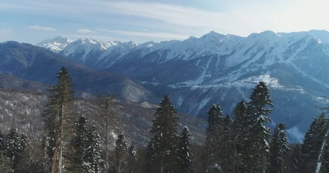 Snow-capped trees and mountains in background. Sochi, Krasnaya Polyana Vidéo 100221170
