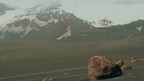 Snow-Capped Volcano and Barren Volcanic Plain at Whalers Bay, Deception Island Stock Footage 332569749
