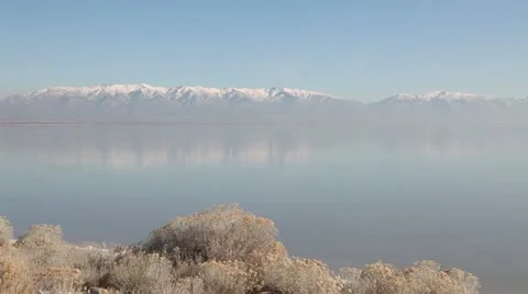 Snow capped Wasatch Mountains from Great Salt Lake, Utah 動画素材 12553454