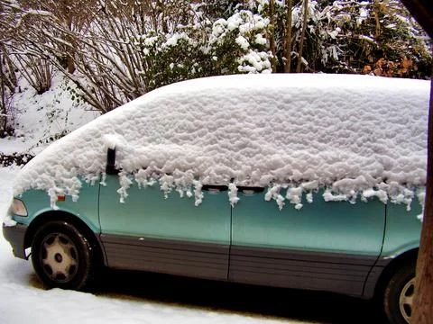 Snow on a Car. Stock Photos