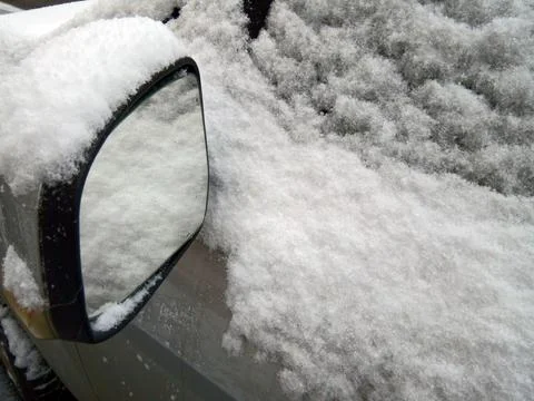 Snow on a car - winter Stock Photos