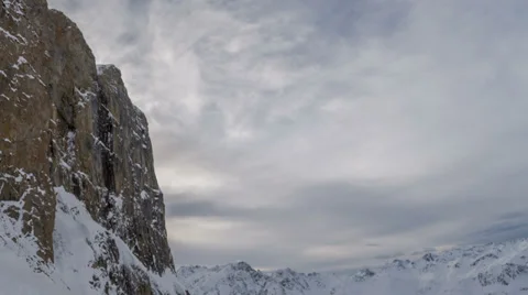 Snow cascading down rock wall Austria Stock Footage 36687615