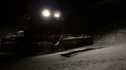 Snow cat crossing the ski slope at night Video stock 44981349