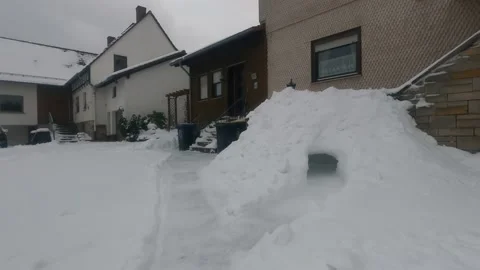 Snow cave igloo constructed in front of a house during winter in Germany. Stock Footage 147752288
