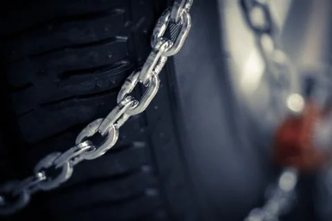 Snow chains on tire Stock Photos