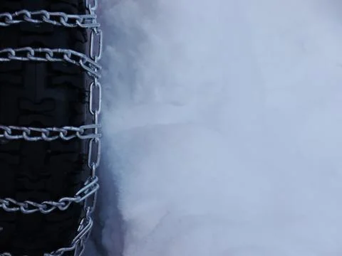 Snow chains tyre Stock Photos