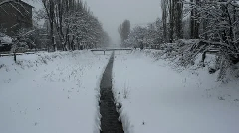 Snow on city river Stock Footage 12653050
