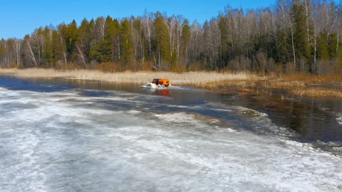 Snow Clad Trail Conqueror. Red ATV Arctic Odyssey. Aerial Drone shot Stock Footage 262629726