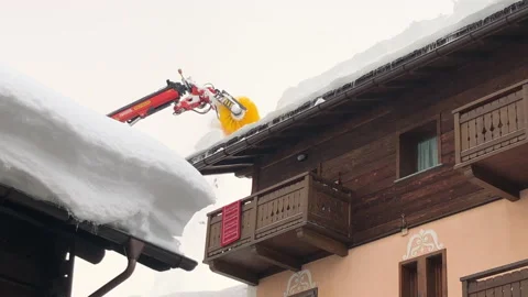 Snow cleaning machine for house roofs Stock Footage 152345282