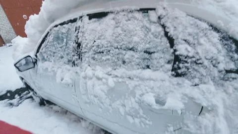 Snow cleaning preparing the car for driving Stock Footage 326499701