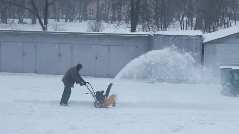 Snow cleaning with snow blower Stock Footage 83688762