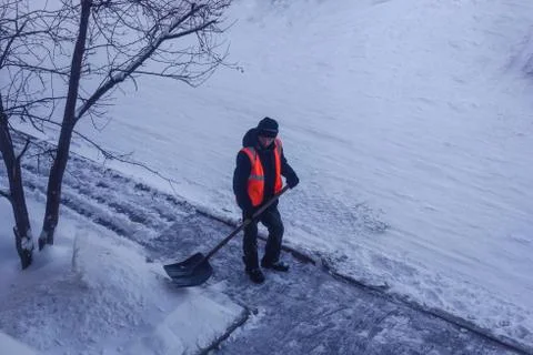 Snow clearance in the yard. Stock Photos