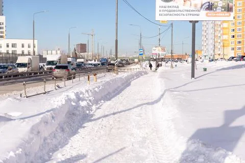 Snow-cleared walking paths. Stock Photos