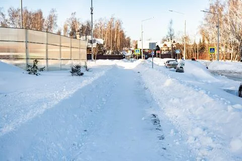 Snow-cleared walking paths. Stock Photos
