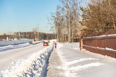Snow-cleared walking paths. Stock Photos