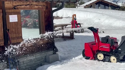 Snow clearing machine on the ski slopes of Courchevel ski resort Stock Footage 337098988
