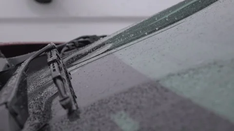 Snow coming down on idling car windshield 4k Stock-Footage 119356426