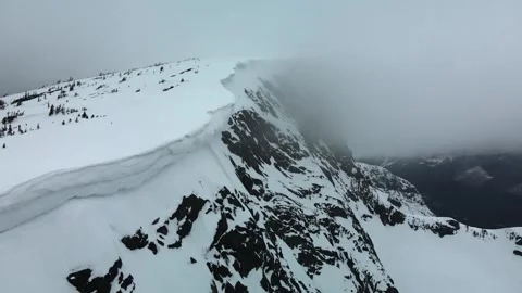 Snow cornice mountain ridge, drone shot Stock Footage 289576596