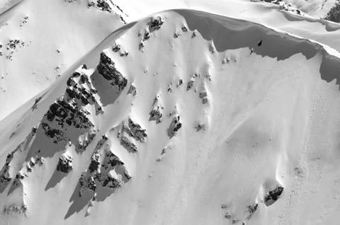 Snow cornice in winter mountains in cold sunny day Stock Photos
